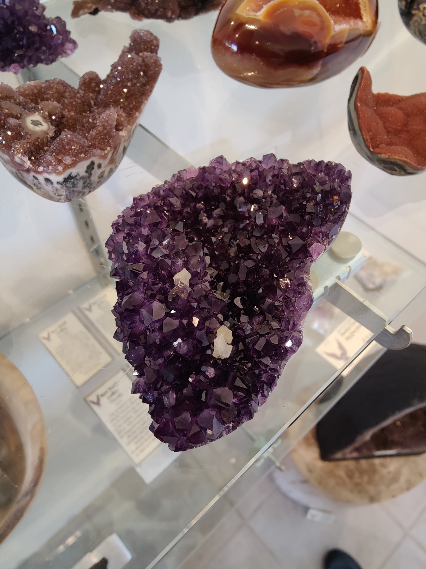 Polished Amethyst with Calcite Crystal Inclusions Geode Sculpture