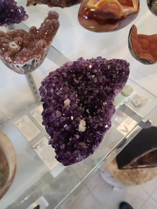 Polished Amethyst with Calcite Crystal Inclusions Geode Sculpture